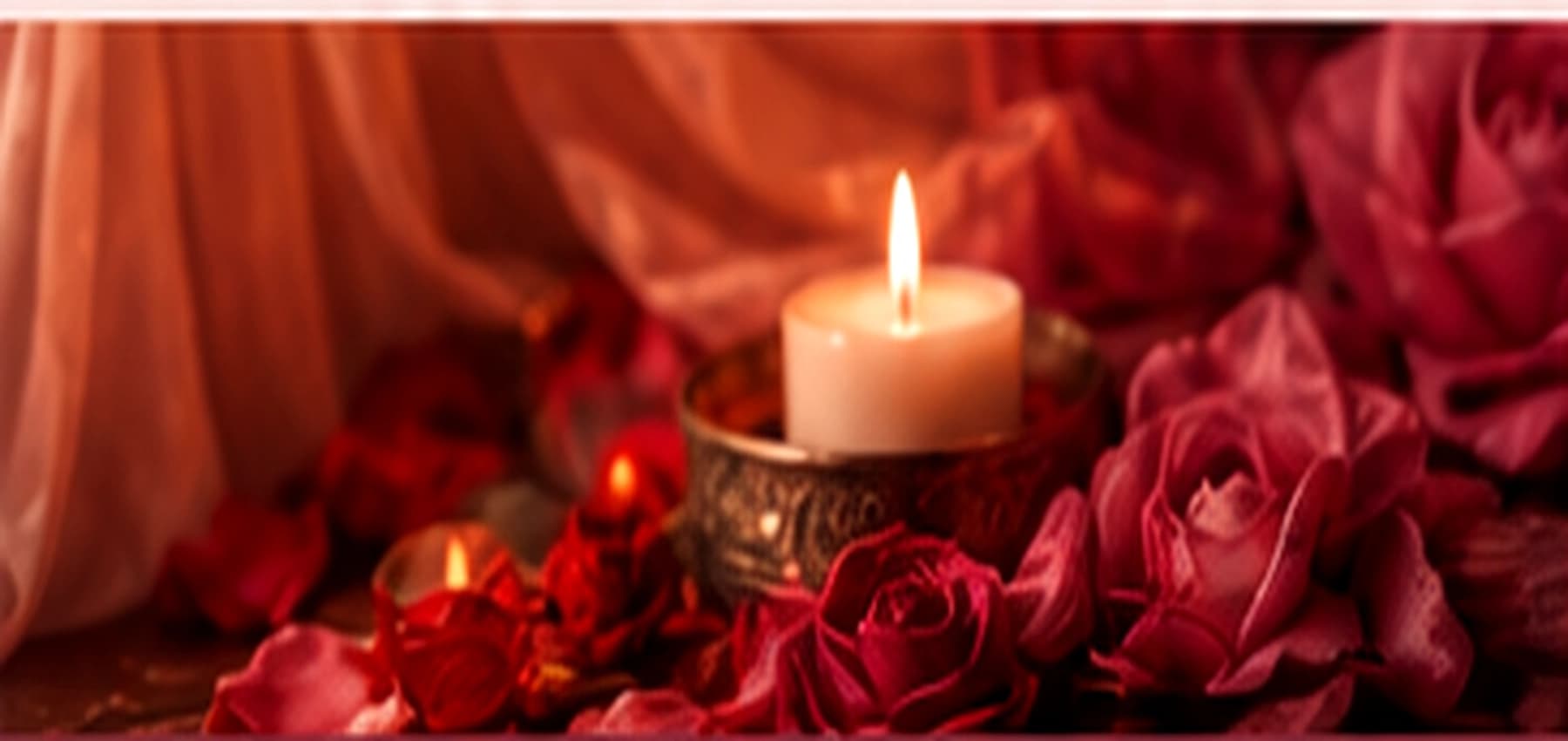 Candlelight and rose petals in a warm ceremonial space